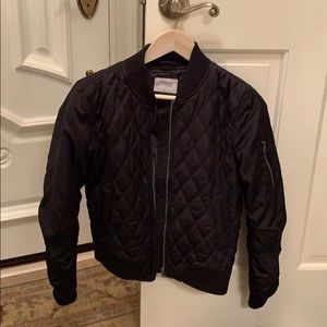 Woman’s bomber patterned jacket.